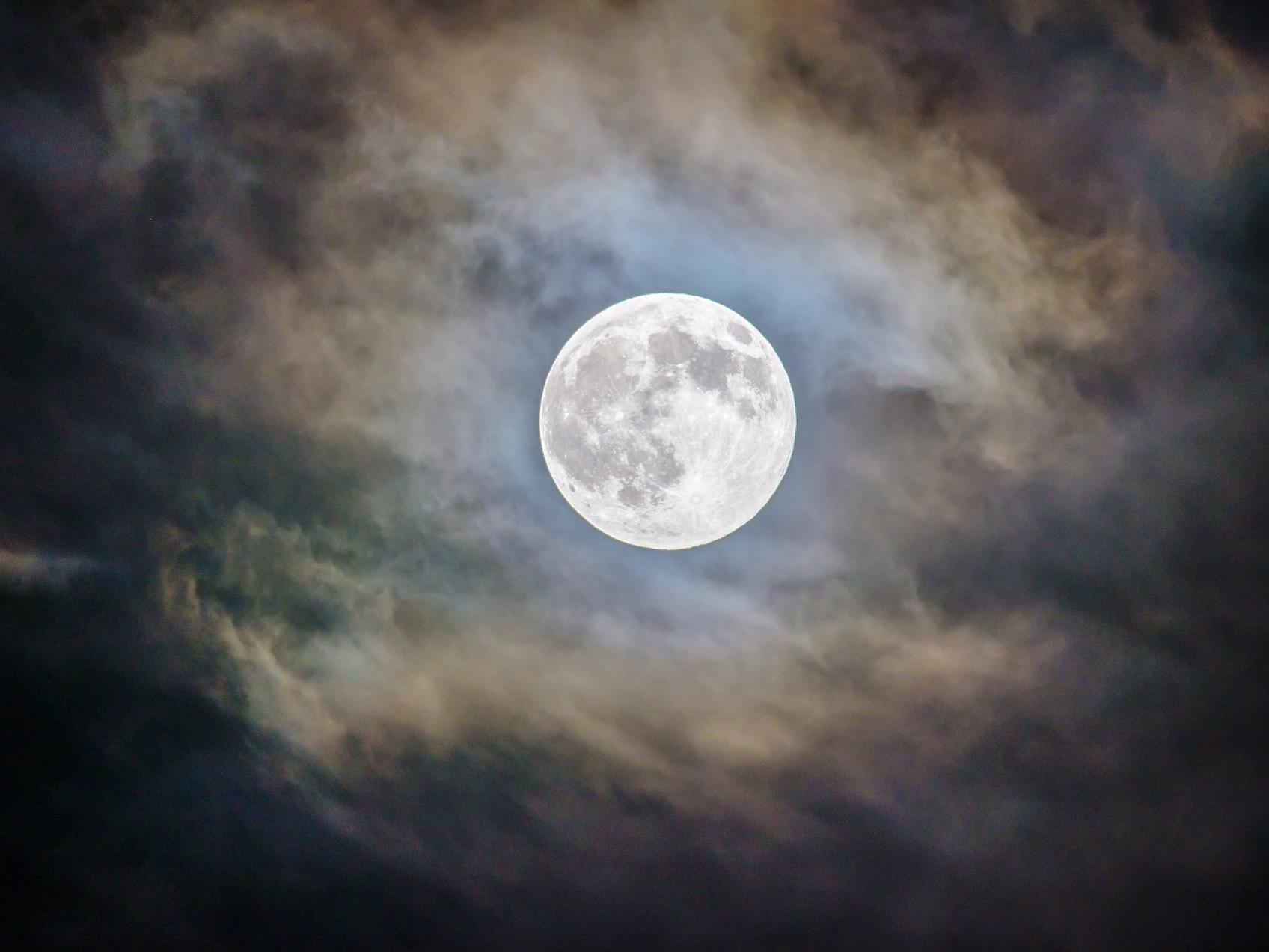 full moon and gray clouds during nighttime